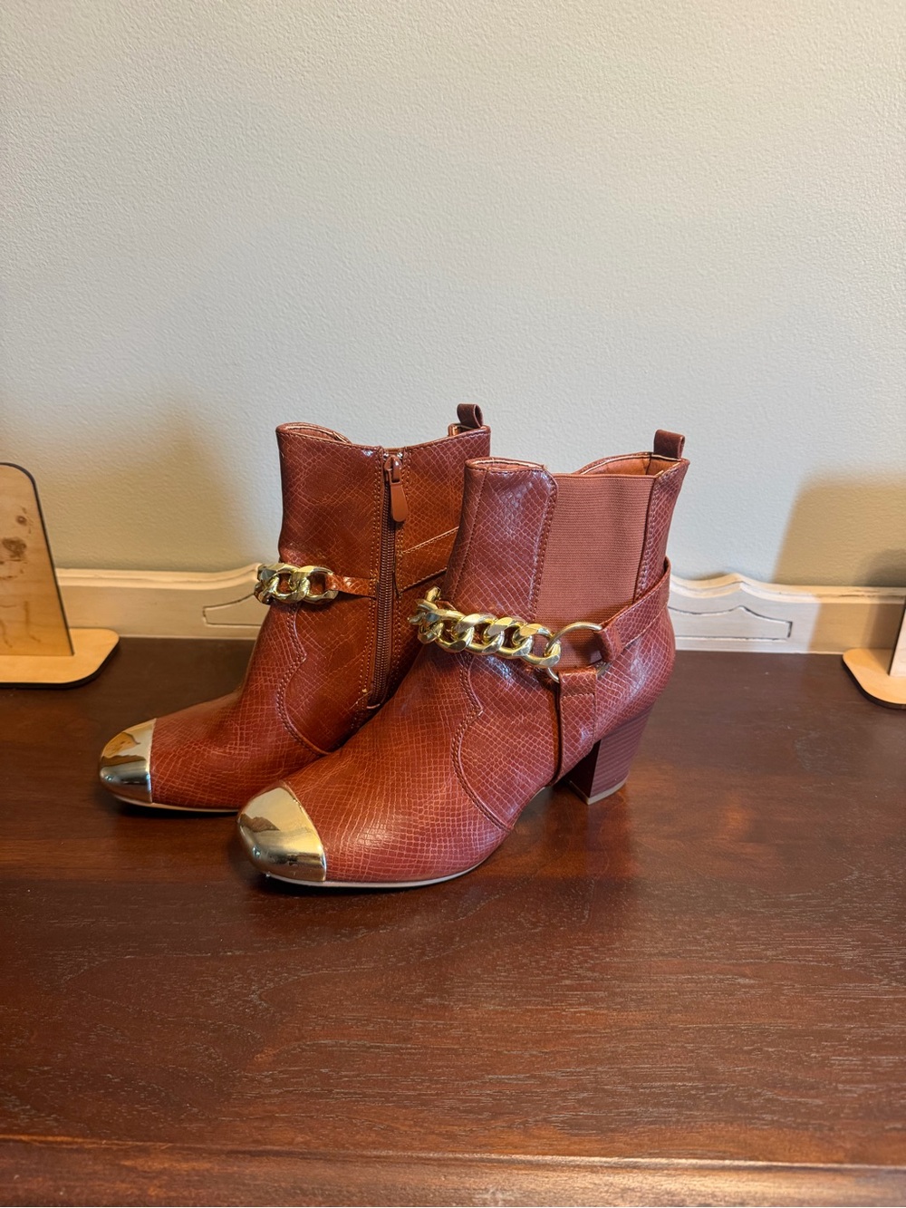 Gold-Toe Brown Ankle Booties with Chain Detail